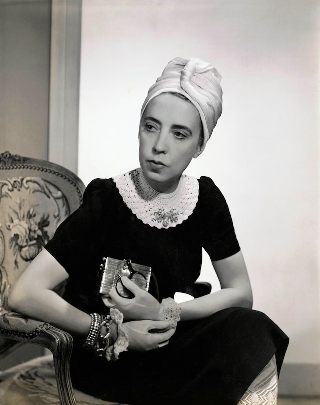 Vogue 1940; Designer Elsa Schiaparelli wearing bla